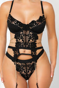 Front view of black crochet lace lingerie set with gold chain details and cut-out design